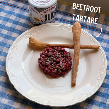 Beetroot tartare on plate next to JUX freeze-dried Beetroot pot