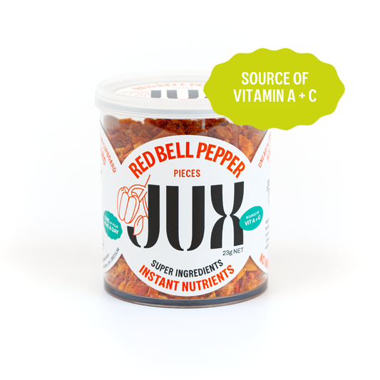 Freeze-dried Red Bell Pepper pieces in a clear jar branded with JUX