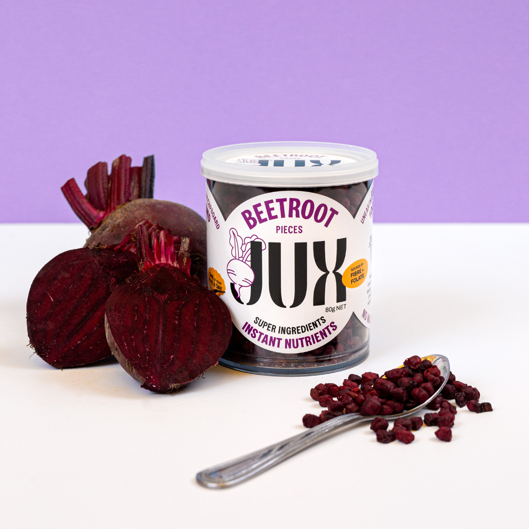 JUX Freeze-dried Beetroot pieces in jar and on spoon next to fresh beetroot